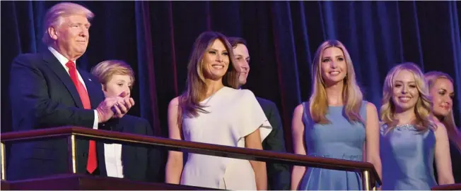  ??  ?? NEW YORK: Republican presidenti­al elect Donald Trump (left) applauds next to his son Barron, his wife Melania, his son Donald John, and daughters Ivanka and Tiffany during election night at the New York Hilton Midtown yesterday. —AFP