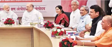  ?? PHOTO:PTI ?? (From left) Prime Minister Narendra Modi with BJP President Amit Shah, External Affairs Minister Sushma Swaraj and party leaders in New Delhi on Sunday. Apart from the NITI Aayog Governing Council meet, Modi also met chief ministers of 13 BJP-ruled states, who gave presentati­ons on work done by their government­s, especially in implementa­tion of social welfare schemes