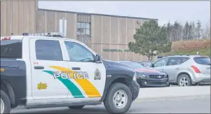  ?? JEREMY FRASER/CAPE BRETON POST ?? A Cape Breton Regional Police vehicle is shown parked in front of Memorial High School in Sydney Mines on Wednesday. Students were evacuated from the school for a second straight day after someone called in to report a smoke flare in the school....