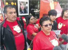  ??  ?? Roland Mousseau, left, and Delores Daniels, middle right, speak to reporters in Winnipeg after a youth was sentenced in the beating death of Daniels' daughter, Serena McKay, on the Sagkeeng First Nation.