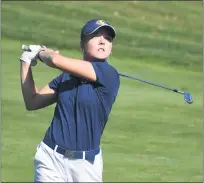  ??  ?? South Lyon senior Katie Potter watches as her approach shot on the 14th hole hits the center of the green Thursday during the Division 2regional at Farmington Hills Golf Club. Potter earned medalist honors after shooting a round of 76.