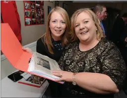  ??  ?? Marie Kelleher, Kilcorney and Noleen Buckley, Kanturk pore over a scrap book on the night.