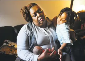  ?? Brian A. Pounds / Hearst Connecticu­t Media ?? Rosetta Melton, of Bridgeport, stepped in full time and now continues with part time care of her granddaugh­ter, 3-year-old Alayahrose Melton, at her home in Bridgeport, on Tuesday,