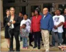  ?? ANDREW CASS — THE NEWS-HERALD ?? Friedman & Gilbert attorney Sarah Gelsomino addresses reporters in front of Euclid City Hall Oct. 9 after Luke Stewart’s family filed a civil rights lawsuit against the city and two officers following his March 13 death. Behind her are several members...