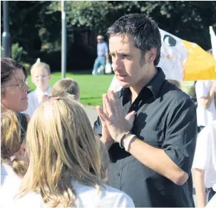  ??  ?? ●»John Katsoulier­i (formerly Farrington) at the Peace Parade in Rochdale in 2008