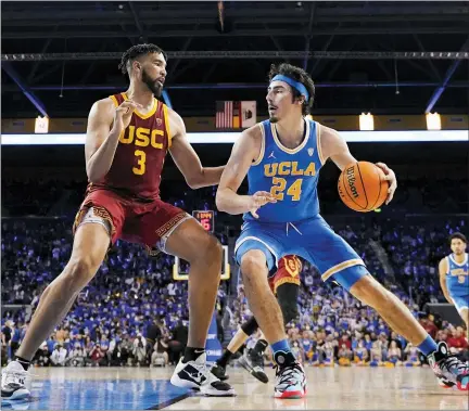  ?? ASSOCIATED PRESS FILE PHOTO ?? UCLA guard Jaime Jaquez Jr., right, tries to get by Southern California forward Isaiah Mobley during a game in March in Los Angeles.