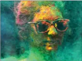  ?? RAJANISH KAKADE — THE ASSOCIATED PRESS FILE ?? A woman smeared with colors celebrates Holi, the Hindu festival of colors, in Mumbai, India, March 7, 2023.