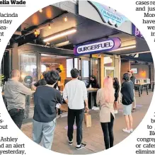  ?? Photos / Lincoln Tan (above), Brett Phibbs (main) ?? Hungry customers queue yesterday for Burger Fuel in Takapuna (above), and (right) in long lines of cars at McDonald’s in Belmont on the North Shore as the lockdown eases slightly in alert level 3.