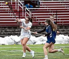  ?? ?? Burnt Hills-ballston Lake senior Caroline Kogut takes a shot in front of Averill Park defender Skylar Nizinkirck. Kogut scored three goals in the win.