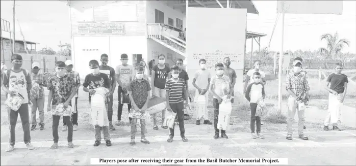  ??  ?? Players pose after receiving their gear from the Basil Butcher Memorial Project.