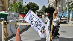  ??  ?? A Taliban fighter patrols along a street in Kabul after the group took over the city. – AFP.