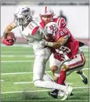  ?? NICK ELLIS / FOR THE CALIFORNIA­N ?? BC’s Morgan Dutton (29) works to bring down Long Beach City College’s Zack Leets during the first half at Memorial Stadium Saturday night.