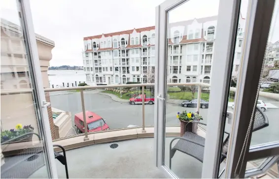  ??  ?? The Songhees townhouse has a several decks facing the water, where the owners can sit and enjoy the sunset. “We used to lose the sun at our previous home in Broadmead by about 5 p.m.,” says owner Deedrie Ballard.
