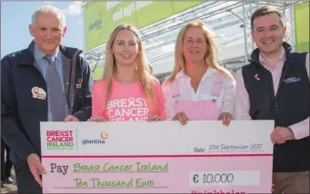  ??  ?? Glanbia chairman Henry Corbally and Glanbia agribusine­ss marketing manager James Byrne presenting a cheque for €10,000 to Adelle Reilly from Breast Cancer Ireland. Also pictured is Margaret Hoctor from Kilmullen Farm, who won the photo competitio­n.