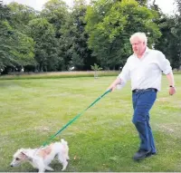  ??  ?? Prime Minister Boris Johnson walking his dog Dilyn as he marks the launch of the Government’s obesity strategy.