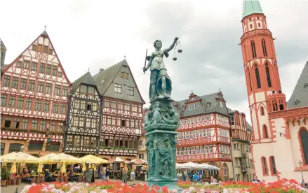  ?? RICK STEVES ?? In Frankfurt’s Romerberg Square, the half-timbered buildings were rebuilt in 1983, after bombs destroyed the originals during World War II.