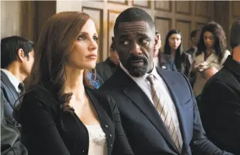  ?? Michael Gibson / STXfilms ?? Jessica Chastain as Molly is counseled by her attorney, played by Idris Elba, in “Molly’s Game,” the directoria­l debut of award-winning writer Aaron Sorkin.