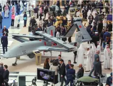 ?? Victor Besa / The National ?? Clockwise from top, a UAE-made GY 300; a Turkish Bayraktar drone; and an M-Buggy, also UAE-made, at Umex