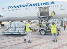  ?? ?? ShelterBox being loaded free of charge