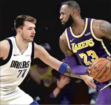  ?? Marcio Jose Sanchez Associated Press ?? LUKA DONCIC, left, was identif ied early by LeBron James as someone the four- time MVP wanted to bring under his brand, but he says now of Doncic: “Doesn’t look like he needs an assistance with what he’s doing.”