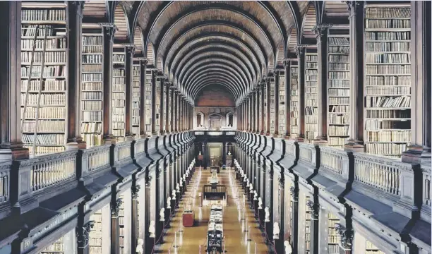  ??  ?? Clockwise from above: The interior of Trinity College Library Dublin by Candida Hofer; a portrait from the Ex Voto series by Alys Tomlinson; portrait of Steven from Margaret Mitchell’s series In This Place