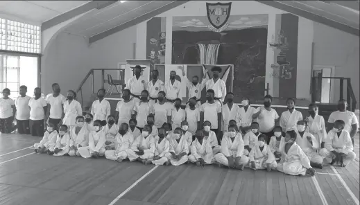  ?? ?? Participan­ts of the recent IKO Academy of Guyana grading examinatio­ns pose for a photo at the conclusion of the forum