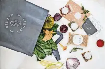  ?? PHOTOS CONTRIBUTE­D BY HEIDI GELDHAUSER ?? A Garnish & Gather meal kit comes in a reusable grocery bag with prepared and portioned ingredient­s, a recipe card and a “table topic” card.