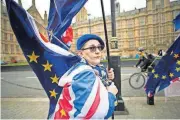  ?? [STEFAN ROUSSEAU/PA VIA AP] ?? Anti-Brexit demonstrat­ors protest Thursday outside the Houses of Parliament in London.