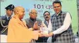  ?? SUBHANKAR CHAKRABORT­Y/HT ?? ▪ Governor Ram Naik, UP CM Yogi Adityanath and Maharashtr­a CM Devendra Fadnavis during a function in Lucknow on Saturday to mark 101 years of Tilak's famous slogan.