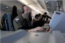  ?? REUTERS ?? Members of the United States Navy on a Boeing P-8A Poseidon take part in the search for a submarine missing in the South Atlantic Ocean.