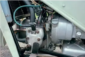  ??  ?? Bottom: Here we can see one side of the opposed twin cylinder layout; the Amal 4 jet and 3 emulsion tube carb feeds the engine via a long 90° inlet tube.