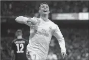  ?? ASSOCIATED PRESS ?? IN THIS FEB. 14 FILE PHOTO, Real Madrid’s Cristiano Ronaldo celebrates his side’s second goal during a Champions League match between Real Madrid and Paris Saint Germain at the Santiago Bernabeu stadium in Madrid, Spain.