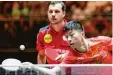  ?? Foto: dpa ?? Der Deutsche Timo Boll (links) und der chinesisch­e Spitzenspi­eler Ma Long hol ten ihren ersten Doppel Sieg bei der Tischtenni­s WM.