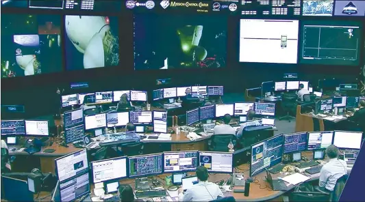  ?? Photo: AFP ?? In this screengrab from a NASA TV broadcast, the SpaceX control room technician­s in Hawthorne, California watch as the crew of the Axiom- 1 mission undocks from the Internatio­nal Space Station on April 25, 2022.