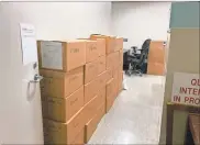  ?? Adam Carey ?? Boxes stack up at the Magistrate Court in the Law Enforcemen­t Center Tuesday morning in preparatio­n for the big move over the weekend.