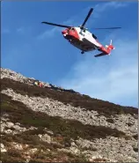  ??  ?? Rescue 117 on the scene at the Sugarloaf on Saturday.