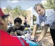  ?? Kent Nishimura Los Angeles Times ?? TOM STEYER, who created the political action committee NextGen America, talks to students at Cal State Fullerton as his group tries to register voters.