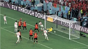  ?? ?? BELGIUM’S Thibaut Courtois concedes against Morocco’s Abdelhamid Sabiri in their Group F clash at the Al-Thumama Stadium yesterday. The Atlas Lions shocked the No 2 team in the world with a 2-0 victory. | AFP