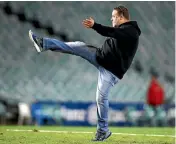  ??  ?? Russell Crowe has a kickabout after his team’s hiding from Manly.