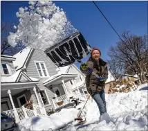  ?? JAKE MAY/FLINT (MICH.) JOURNAL ?? Boris Yakubchik clears his driveway Saturday in Lapeer, Michigan, after a snowstorm dropped 9 inches of snow overnight. Many in Michigan were without power Friday evening.