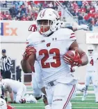  ?? GETTY IMAGES ?? Wisconsin's Jonathan Taylor scores on a 32-yard touchdown run against Indiana.