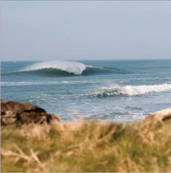  ??  ?? A perfect wave captured by Strandhill surfer and photograph­er, Andrew Kilfeather