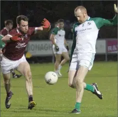  ??  ?? Brendan Doyle (St. James’) kicks as Daithí Waters attempts to block.