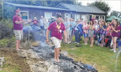  ?? FM4438183 ?? Scout Leader Phil Smith is cheered as he does the walk