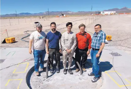  ?? COURTESY OF SANDIA LABS ?? Sandia National Laboratori­es researcher­s, from left, Zack Cashion, Rob Abbott, Danny Bowman, Mark Timms and Austin Holland stand on an 8-foot-diameter hole filled with gravel, sand, cement and explosives before an undergroun­d explosion this summer.