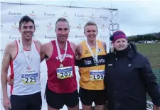  ??  ?? North Sligo AC’s Feidhlim McGowan 3rd in National Intermedia­te Crosscount­ry, Michael Harty 1st, Kevin Moore 2nd and Georgina Drum President Athletics Ireland in Clarinbrid­ge on Sunday.