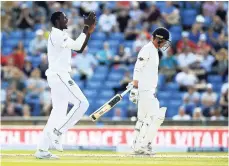  ?? FILE ?? West Indies captain Jason Holder (left) celebrates after taking the wicket of England’s Tom Westley at Headingley, Leeds, during last summer’s Test series.