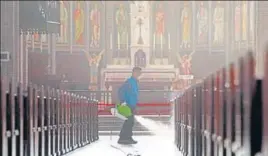  ?? AFP ?? A staff member sprays disinfecta­nt as part of preventive measures against the spread of coronaviru­s at Myeongdong Catholic Cathedral in Seoul on Wednesday. The total number of infections in South Korea had risen to more than 1,000.