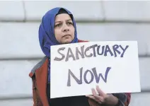  ?? Jeff Chiu / Associated Press 2017 ?? Moina Shaiq demonstrat­es in favor of California’s sanctuary law in S.F. in 2017. The U.S. Supreme Court denied review of a lowercourt ruling upholding the law.