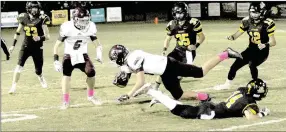  ?? MARK HUMPHREY ENTERPRISE-LEADER ?? Prairie Grove senior cornerback Tyler Davidson upends Gentry receiver Peyton Wright after a 1-yard gain on a pass play in the third quarter. The Tigers won 32-7 Friday to remain in the 4A-1 Conference race.